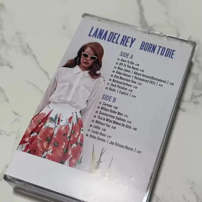 Cassette musicale Born To Die, indie rêveur et pop rétro avec des arrangements cinématiques somptueux et des récits lyriques sombres