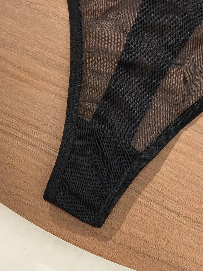 Body en dentelle noire avec broderie florale