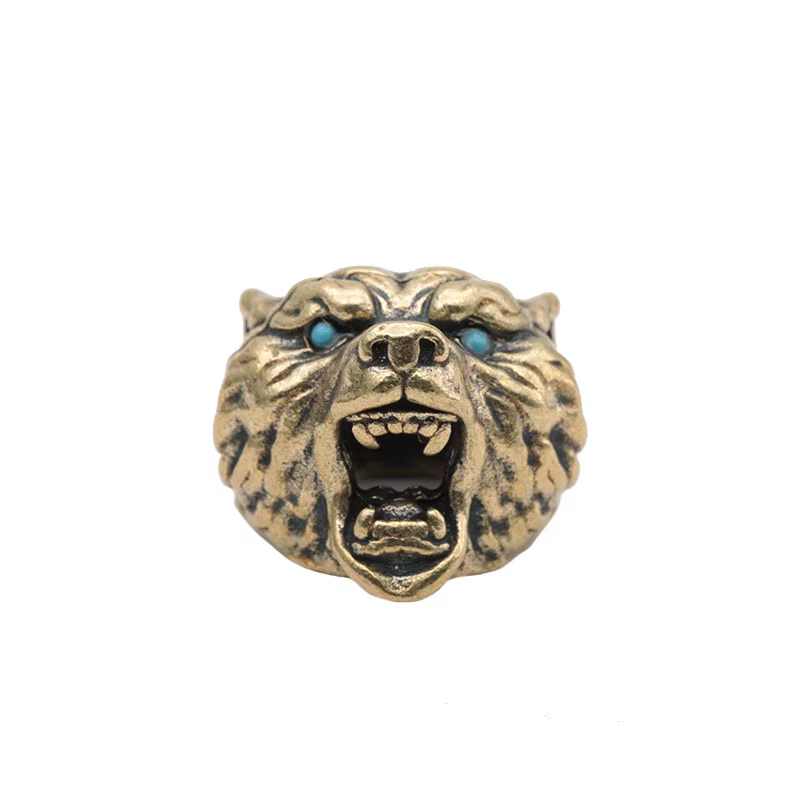 Sculpture de tête d'ours brun rugissant avec yeux bleus noirs, perle de paracorde en laiton, pendent
